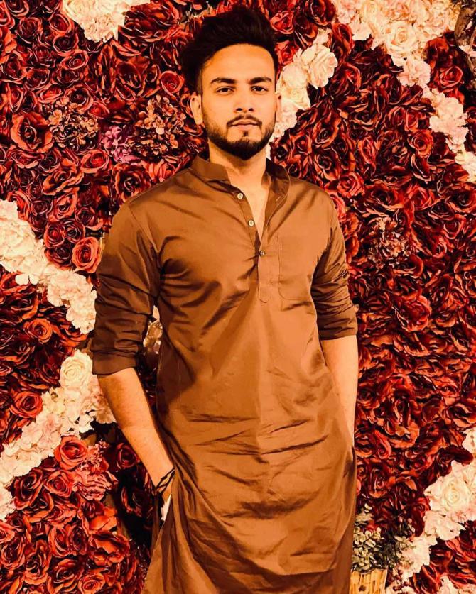 A portrait of Elvish in a traditional Haryanvi kurta, looking sharp.